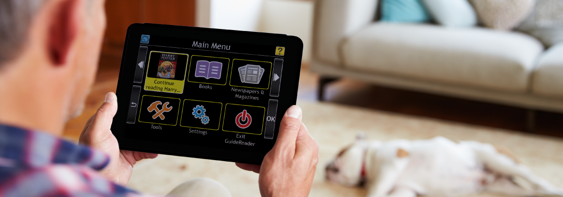 Man relaxing on the sofa with GuideReader